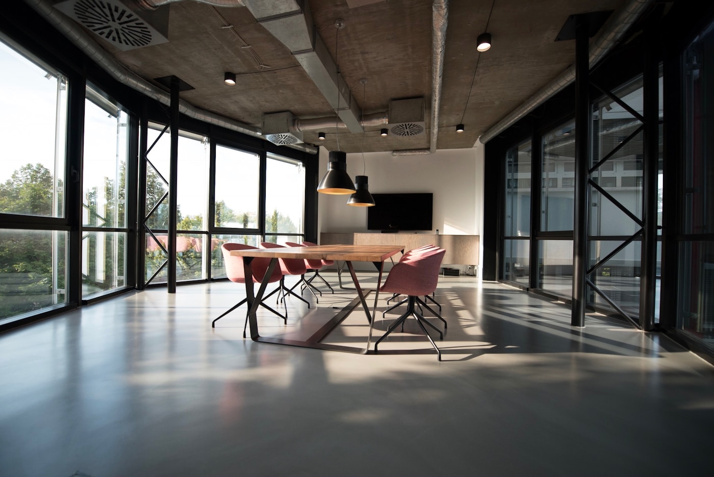 Daylit workspace with a meeting table and large windows